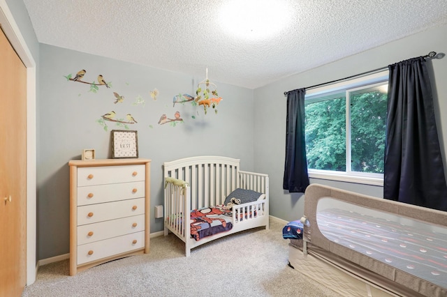 1310 Widgeon Way, Buffalo, MN 55313 - bedroom featuring a textured ceiling, carpet floors, and a nursery area