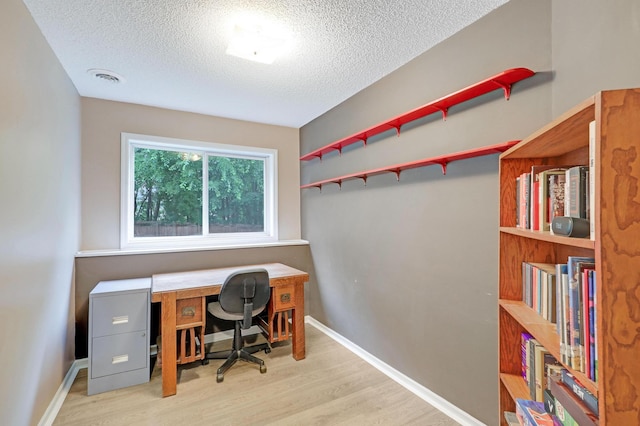 1310 Widgeon Way, Buffalo, MN 55313 - office area featuring a textured ceiling and wood finished floors