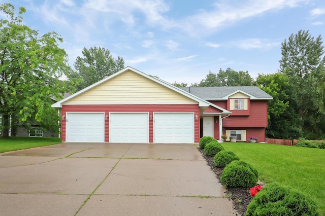 1310 Widgeon Way, Buffalo, MN 55313 - tri-level home featuring a front yard, driveway, and a garage