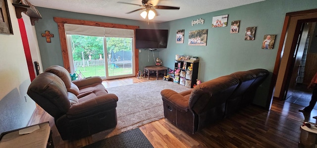 210 E St S, Underwood, MN 56586 - living room featuring ceiling fan, wood finished floors, and a textured ceiling