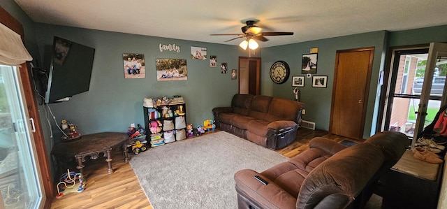 210 E St S, Underwood, MN 56586 - living room featuring ceiling fan and wood finished floors