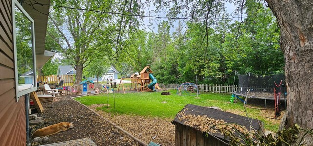 210 E St S, Underwood, MN 56586 - view of yard featuring a playground and a trampoline