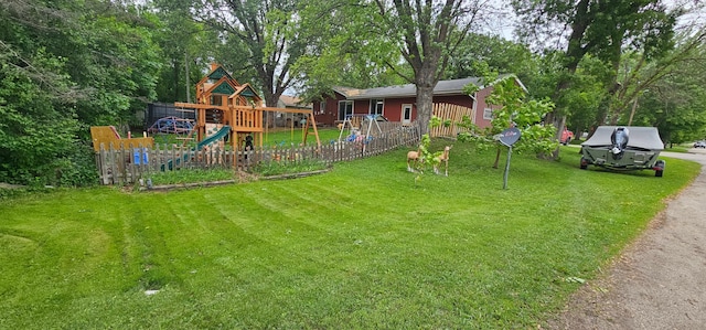 210 E St S, Underwood, MN 56586 - view of yard with a playground and view of wooded area