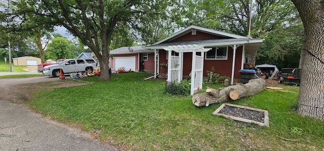 210 E St S, Underwood, MN 56586 - view of front of home featuring a garage, a front lawn, and driveway