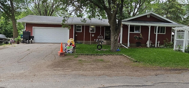 210 E St S, Underwood, MN 56586 - view of front of home featuring asphalt driveway, a garage, and a front yard
