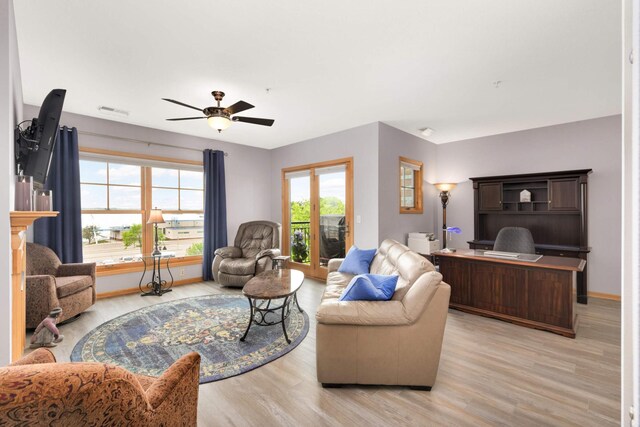4100 Spring St Unit 310, Spring Park, MN 55384 - living area with light wood finished floors and a ceiling fan