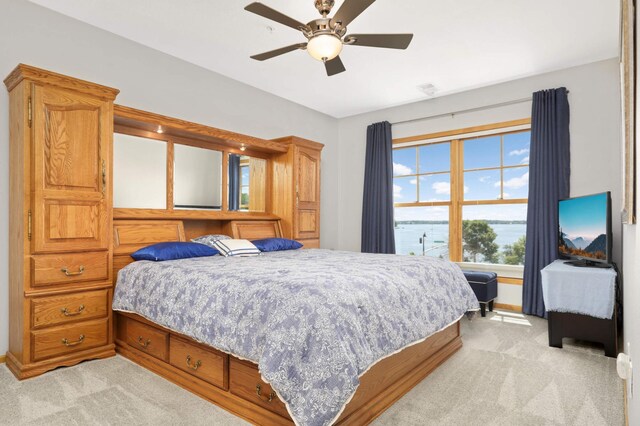 4100 Spring St Unit 310, Spring Park, MN 55384 - bedroom featuring light colored carpet and ceiling fan