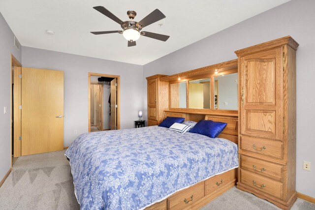 4100 Spring St Unit 310, Spring Park, MN 55384 - bedroom with carpet floors, ceiling fan, and a walk in closet