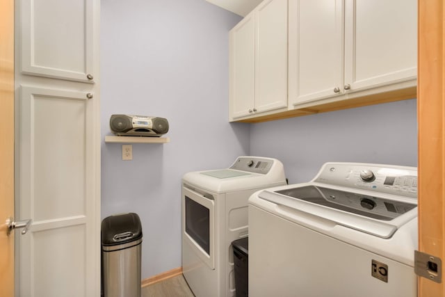 4100 Spring St Unit 310, Spring Park, MN 55384 - washroom featuring independent washer and dryer and cabinet space