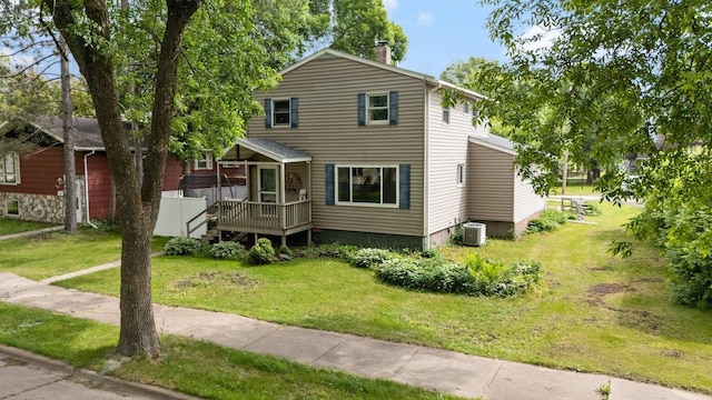1412 11th St S, Virginia, MN 55792 - traditional-style home featuring a chimney, a front lawn, and central air condition unit