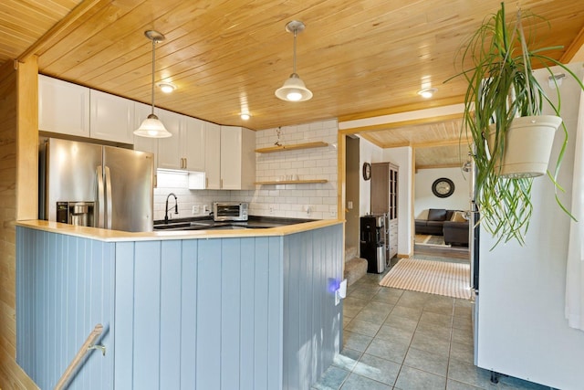 1412 11th St S, Virginia, MN 55792 - kitchen with stainless steel refrigerator with ice dispenser, wooden ceiling, a sink, decorative backsplash, and white cabinets