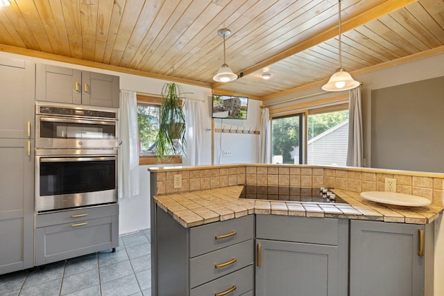 1412 11th St S, Virginia, MN 55792 - kitchen with gray cabinetry, black electric stovetop, light tile patterned floors, stainless steel double oven, and wooden ceiling