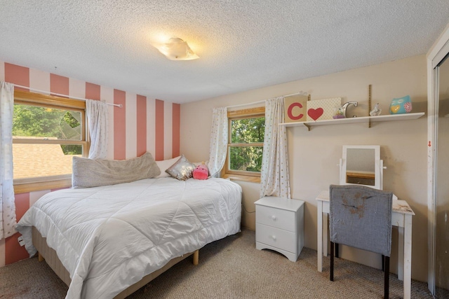 1412 11th St S, Virginia, MN 55792 - bedroom featuring multiple windows, carpet, wallpapered walls, and a textured ceiling