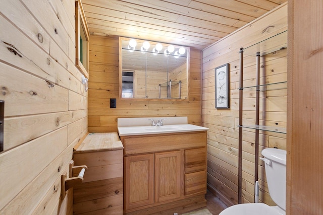 1412 11th St S, Virginia, MN 55792 - bathroom featuring wooden ceiling, wooden walls, vanity, and toilet