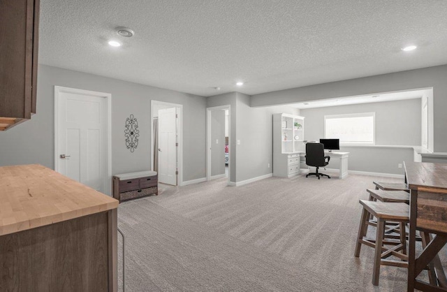 5201 Ramier Ave NE, Otsego, MN 55374 - dining space featuring an office area, light carpet, a textured ceiling, recessed lighting, and baseboards