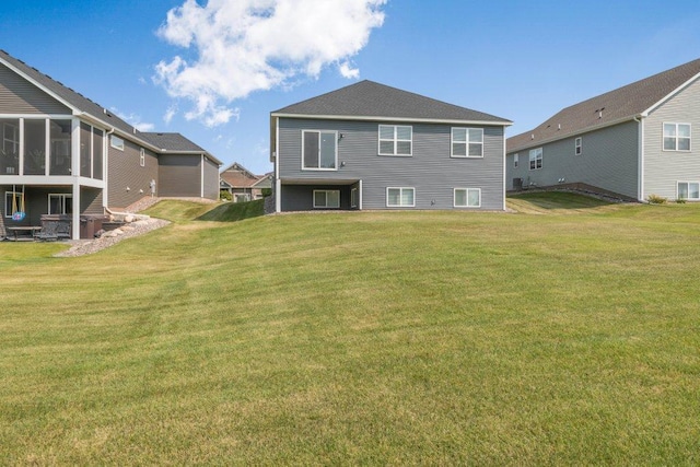 5201 Ramier Ave NE, Otsego, MN 55374 - rear view of house with a lawn and a sunroom