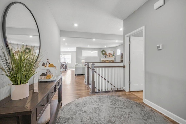 5201 Ramier Ave NE, Otsego, MN 55374 - hall with wood finished floors, baseboards, an upstairs landing, and recessed lighting