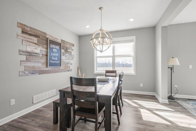5201 Ramier Ave NE, Otsego, MN 55374 - dining space featuring a chandelier, wood finished floors, baseboards, and recessed lighting