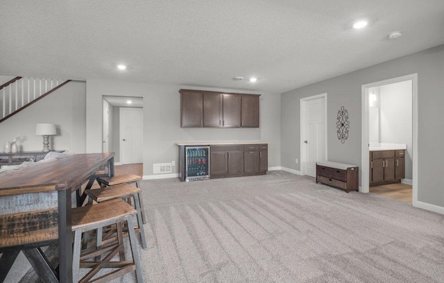 5201 Ramier Ave NE, Otsego, MN 55374 - indoor dry bar featuring light colored carpet, wine cooler, a textured ceiling, baseboards, and recessed lighting