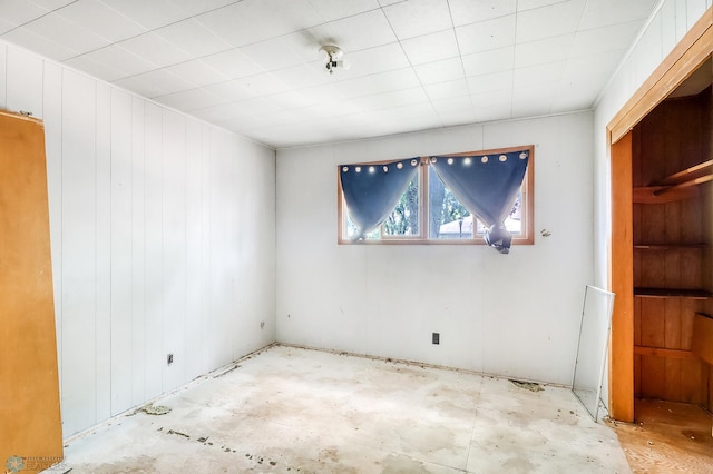 1002 10th St N, Fargo, ND 58102 - spare room with wooden walls