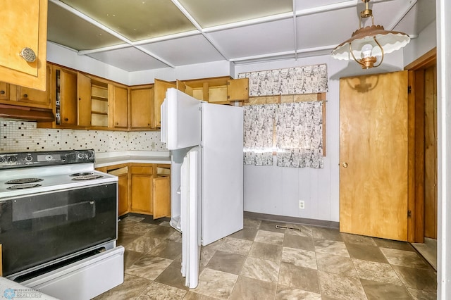 1002 10th St N, Fargo, ND 58102 - kitchen featuring range with electric stovetop, freestanding refrigerator, light countertops, tasteful backsplash, and brown cabinets