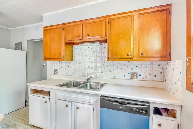 1002 10th St N, Fargo, ND 58102 - kitchen with dishwasher, freestanding refrigerator, light countertops, light flooring, and backsplash