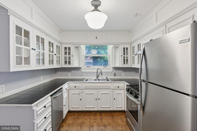 76 Western Ave N, Saint Paul, MN 55102 - kitchen featuring stainless steel appliances, tile countertops, white cabinets, glass insert cabinets, and dark wood-style floors
