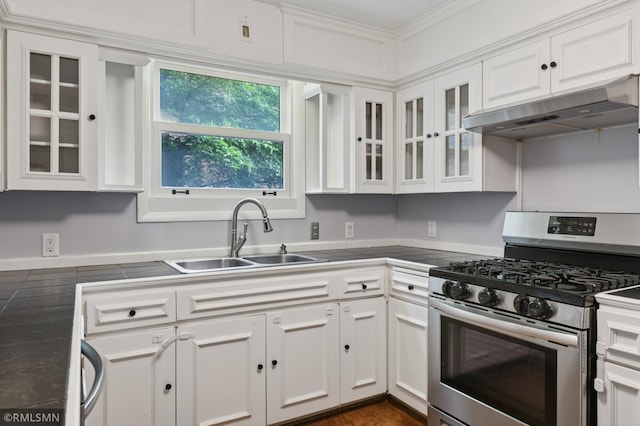 76 Western Ave N, Saint Paul, MN 55102 - kitchen with stainless steel gas range oven, under cabinet range hood, white cabinets, glass insert cabinets, and tile countertops