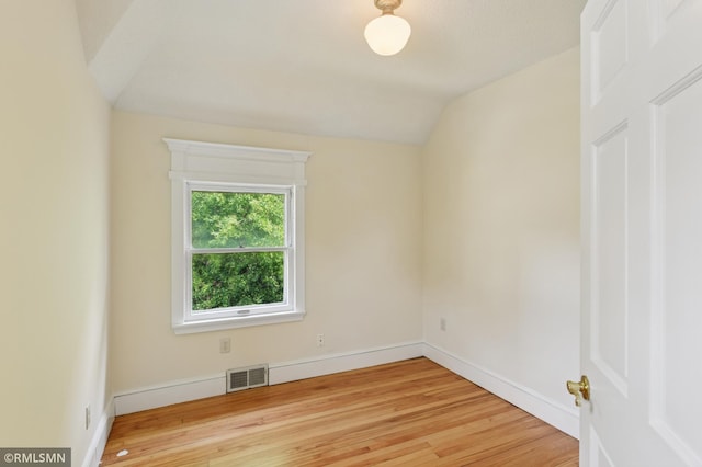 76 Western Ave N, Saint Paul, MN 55102 - spare room featuring vaulted ceiling and light wood finished floors