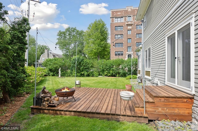 76 Western Ave N, Saint Paul, MN 55102 - deck featuring a fire pit and a lawn