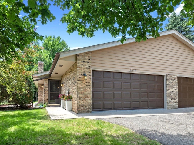 7079 Robinwood Trl, Woodbury, MN 55125 - mid-century inspired home featuring brick siding, a chimney, and a front lawn