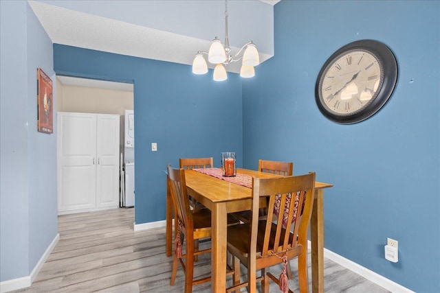 7079 Robinwood Trl, Woodbury, MN 55125 - dining space with a chandelier and light wood finished floors