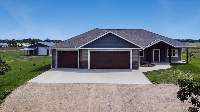 39847 447th St, Sauk Centre Twp, MN 56378 - ranch-style house with concrete driveway, a front yard, a garage, and stone siding