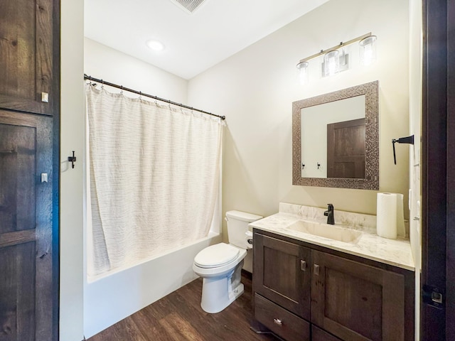 39847 447th St, Sauk Centre Twp, MN 56378 - bathroom featuring toilet, wood finished floors, vanity, and shower / tub combo