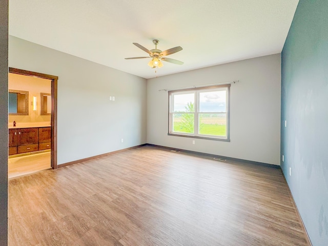 39847 447th St, Sauk Centre Twp, MN 56378 - spare room featuring ceiling fan, light wood-style flooring, and baseboards