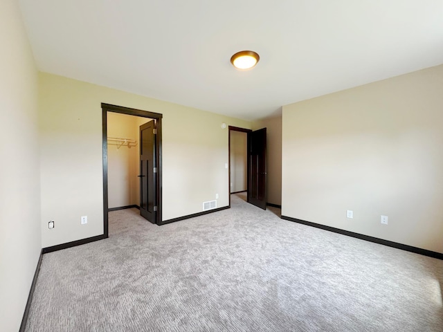 39847 447th St, Sauk Centre Twp, MN 56378 - unfurnished bedroom featuring light colored carpet, baseboards, and a spacious closet