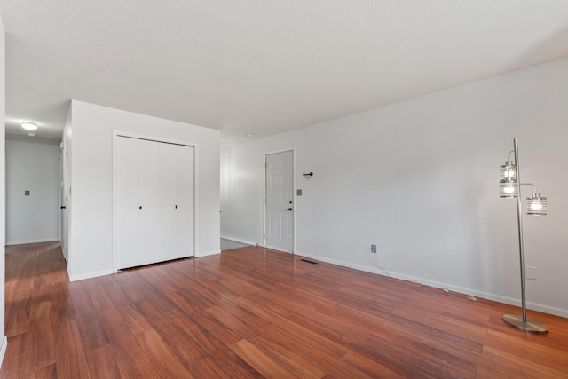 2452 Parkview Ln SE, Rochester, MN 55904 - unfurnished bedroom featuring wood finished floors, baseboards, and a closet