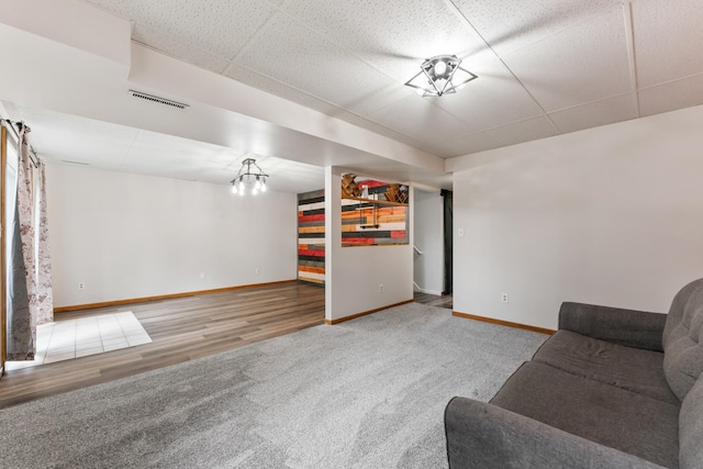 2452 Parkview Ln SE, Rochester, MN 55904 - carpeted living room with baseboards, wood finished floors, and a drop ceiling