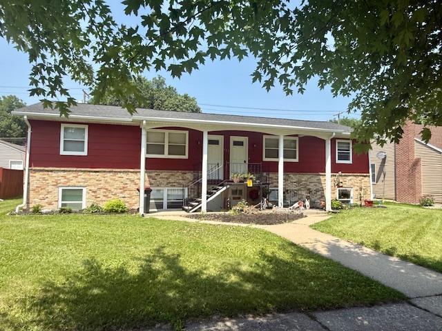 411 Broadway St, Redwood Falls, MN 56283 - single story home with a front lawn and stone siding