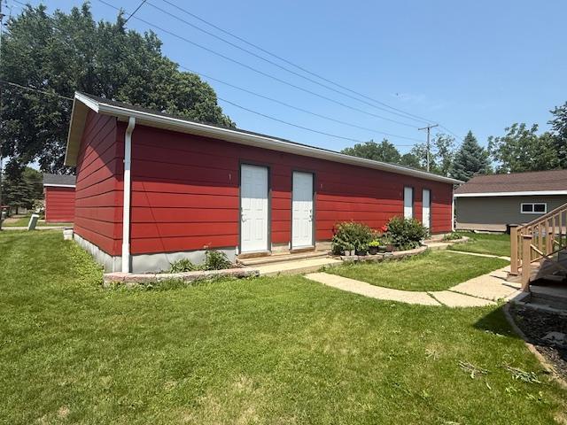 411 Broadway St, Redwood Falls, MN 56283 - back of property featuring a lawn