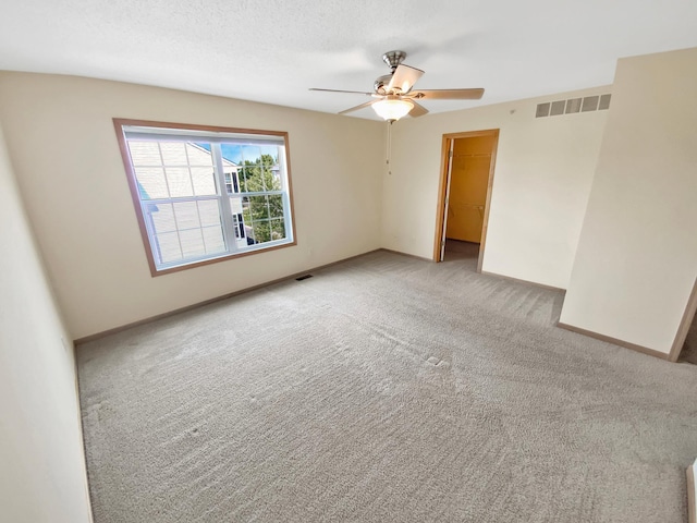 15579 June Grass Ln, Eden Prairie, MN 55347 - spare room featuring light colored carpet and ceiling fan