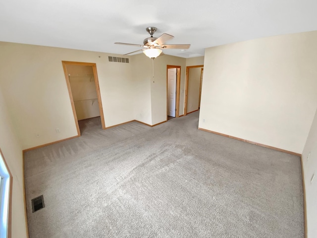 15579 June Grass Ln, Eden Prairie, MN 55347 - unfurnished room with a ceiling fan, baseboards, and light colored carpet