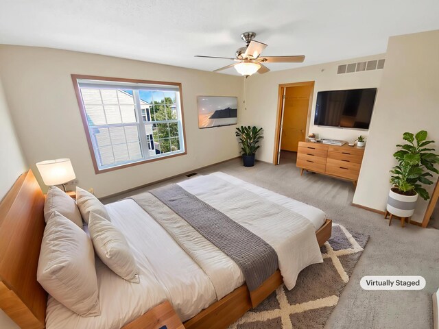 15579 June Grass Ln, Eden Prairie, MN 55347 - bedroom featuring light colored carpet, a ceiling fan, and a spacious closet