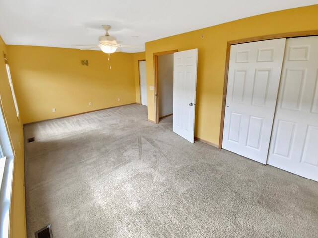 15579 June Grass Ln, Eden Prairie, MN 55347 - unfurnished bedroom featuring light carpet and a ceiling fan
