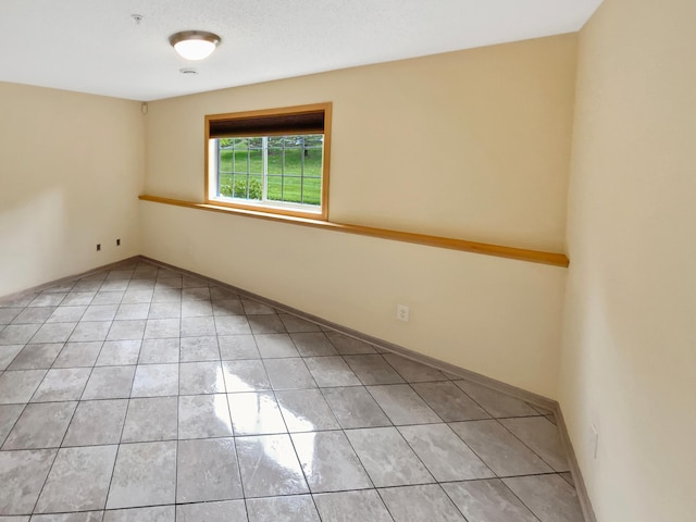 15579 June Grass Ln, Eden Prairie, MN 55347 - empty room with light tile patterned floors and fire sprinkler in ceiling
