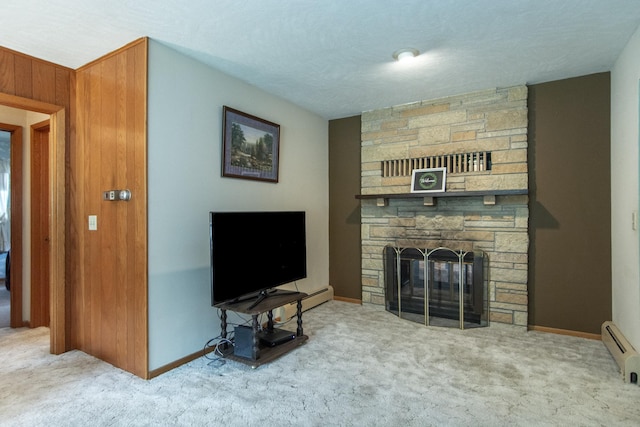 2103 Graydon Ave, Brainerd, MN 56401 - living room featuring a fireplace, a baseboard heating unit, carpet flooring, and baseboards
