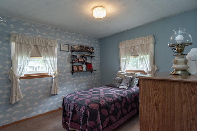 2103 Graydon Ave, Brainerd, MN 56401 - bedroom with multiple windows, carpet, wallpapered walls, and baseboards