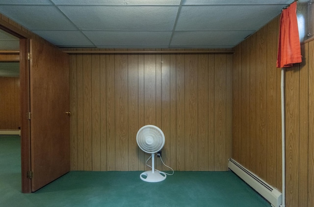 2103 Graydon Ave, Brainerd, MN 56401 - interior space featuring baseboard heating, carpet, wooden walls, and a drop ceiling
