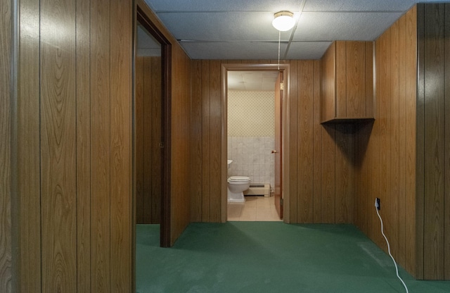 2103 Graydon Ave, Brainerd, MN 56401 - hall featuring a baseboard heating unit, carpet, and wooden walls