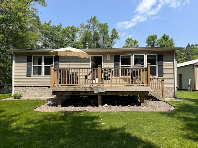 38634 241st St, Aitkin, MN 56431 - back of house featuring a lawn and a deck